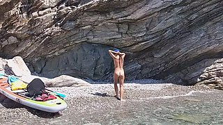 Nudist beach pissing by a slender brunette with small tits