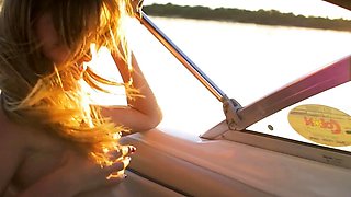 Ukrainian bombshell relaxed nude on boat