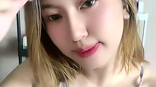 Blonde Asian Girl Masturbating with Milk