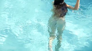 Beautiful Redhead's Playful Charm by the Poolside