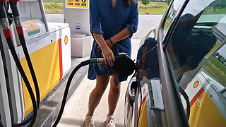 She Is Refueling at the Gas Station, Showing Her Tits and Pussy