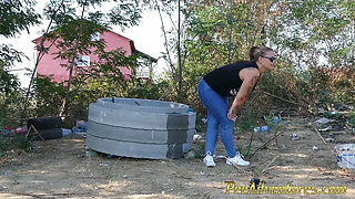 Pee standing on a dirt road in the countryside - Wet her panties outdoor and smoke until they dry