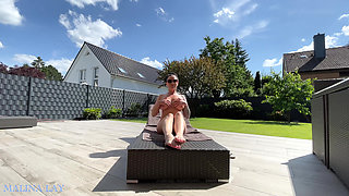 Hot milf pampers her sexy body on the terrace and oils herself