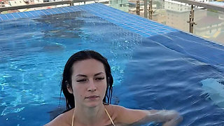 Rooftop Pool Cleavage Tease in Tiny Bikini