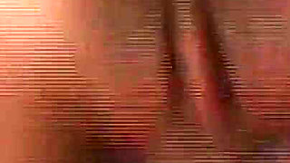 She Lies Naked on the Beach While He Watches Her