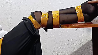 Tied with Plastic Tape Gagged with a Heel on the Face and Being Masturbated with a Toy