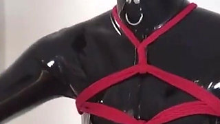 Mz27 - a Girl Bound in Latex Walks on a Treadmill