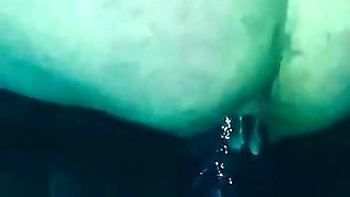 Riding a huge dildo.