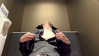 Nipple masturbation in a public restroom