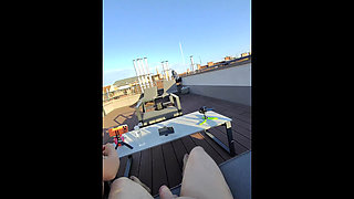 Super sexy and hot real redhead masturbates on open terrace under the sun spreads legs and gives an oily handjob