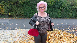 Naughty Granny Tongue Out Flashing Big Tits in Public