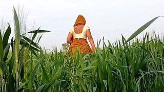 Desi 18-year-old married bhabhi fingers her wet pussy in the field, then brother fucks her tight butt outdoors