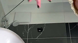 Amazingly Beautiful Hot Brunette Babe in the Bathroom Takes Her Thong off Under White Mini Tennis Skirt to Flash Shaved Pussy