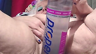 Big Bottle Plugged Clit Cunt