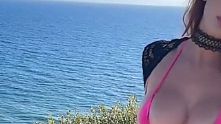 Artemisia Love Wearing Sexy Clothes and Smoking and Flashing Her Big Juicy Boobs in a Perfect Place by the Ocean