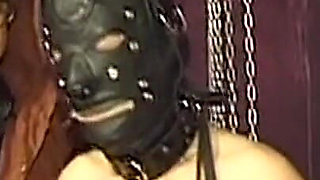 Chained Mature Beauty Receives Deep Gloved Fisting