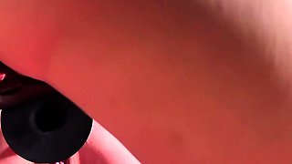 Sexy brunette lesbian riding a big strapon