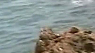 Horny Redhead Babe Fingers Pussy on Wild Beach