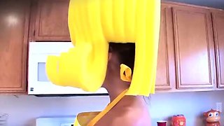 A gal adult in a yellow costume fetish solo