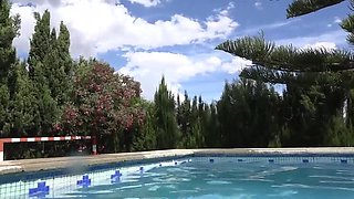 Brunette babe with nice tits pisses by the pool while showering