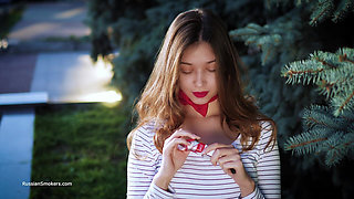 Sultry Russian Girl Smoking Cigarette by Waves
