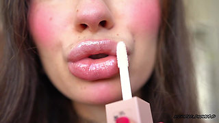 Pillow-soft Glossed Lips in a Melting Sensual Kiss