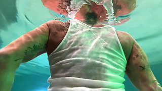 Amazon Kandy Flexes Her Massive Biceps in Her Hotel Pool