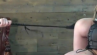 Mistress Whips Male Masochist Who Is Holding Dildo in His Mouth to Prevent It From Falling Out of Female Masochist Pussy