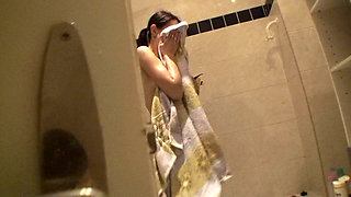 Sexy brunette teen is taking a shower