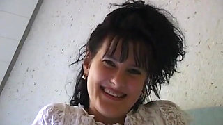 Horny girl lays in bed finger fucking herself and stroking clit