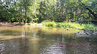Cute Teen in Costume Playing in the River Like in a Swimming Pool