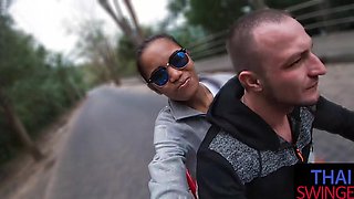 Thai babe in a miniskirt gives wild blowjobs under nature's embrace