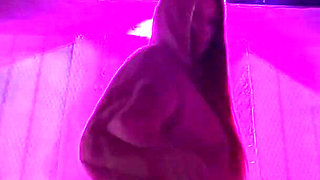 Smoking a Cigarette Outdoor While Wearing Only a Bikini and a Jacket