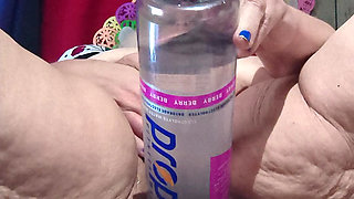 Big Bottle Plugged Clit Cunt