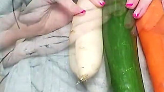 Queen of Vegetables Fucks Cucumber in Black Condom