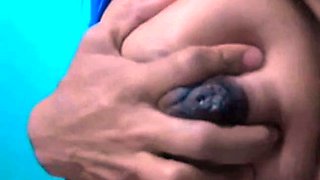 Squeezing Milk Out of Her Dark Nipples on Webcam