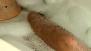 A Slender Beauty Takes a Bath with Foam Caressing Pussy. Annahomemix