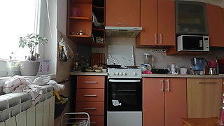 A Sexy Naked Woman Prepares Food in the Kitchen