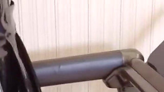 Mz24 - a Girl Bound to a Treadmill with Metal Restraints and Shackles