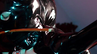 German Latex Slut is Bound and gagged and gets a spanking session