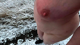 Complete naked busty girl in the snow