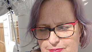 Calm Outdoor Smoking Moment with a Playful Lipstick Look