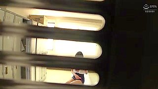 An office lady takes off her bra and masturbates by placing a vibrator over her pantyhose.