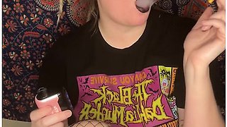 Smoking a cigarette with bold black lipstick