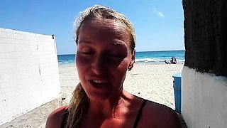 Outdoor solo masturbation scene with curly blonde
