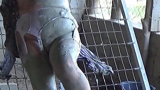 Tied to a Bed Frame Covered in Mud 00106